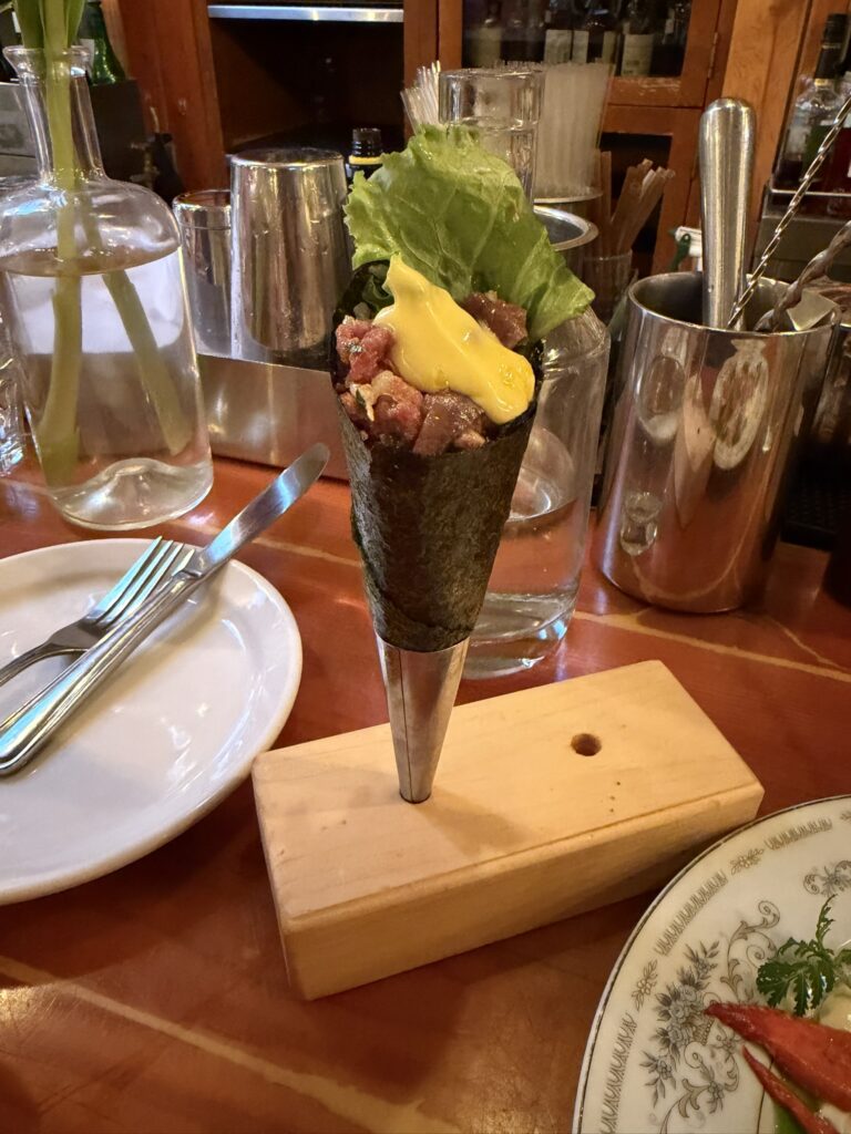 Duck Temaki 2.0 served in a crispy seaweed cone at Au Pied de Cochon